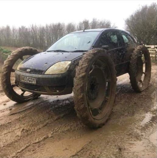 Modified hatchback with oversized off‑road wheels (custom / for parts)