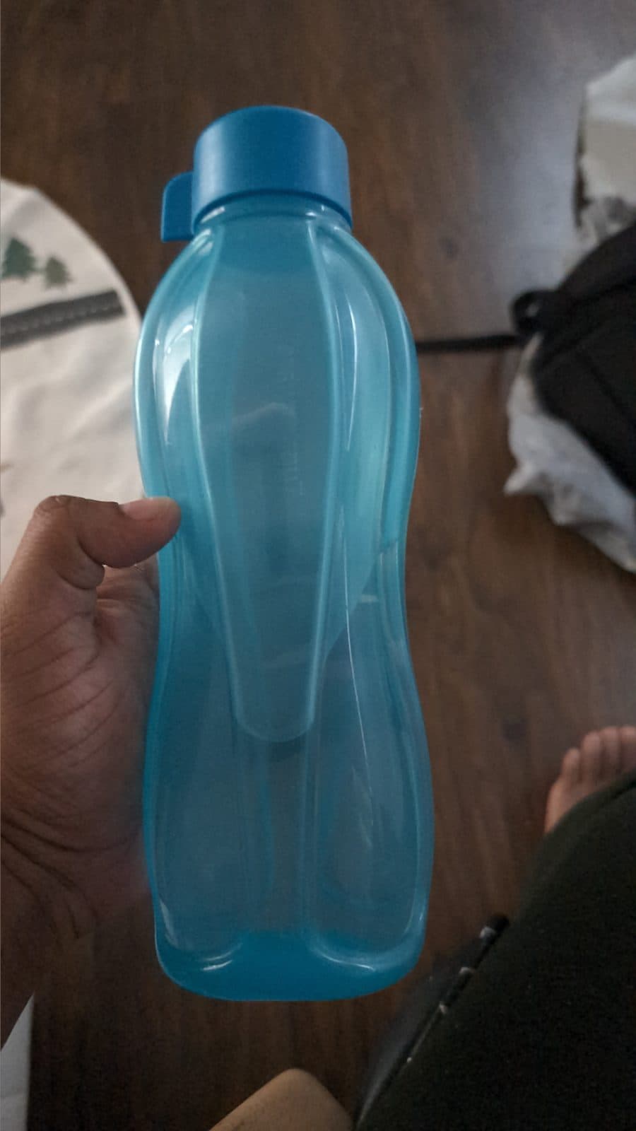 Blue reusable plastic water bottle — 500–750 ml