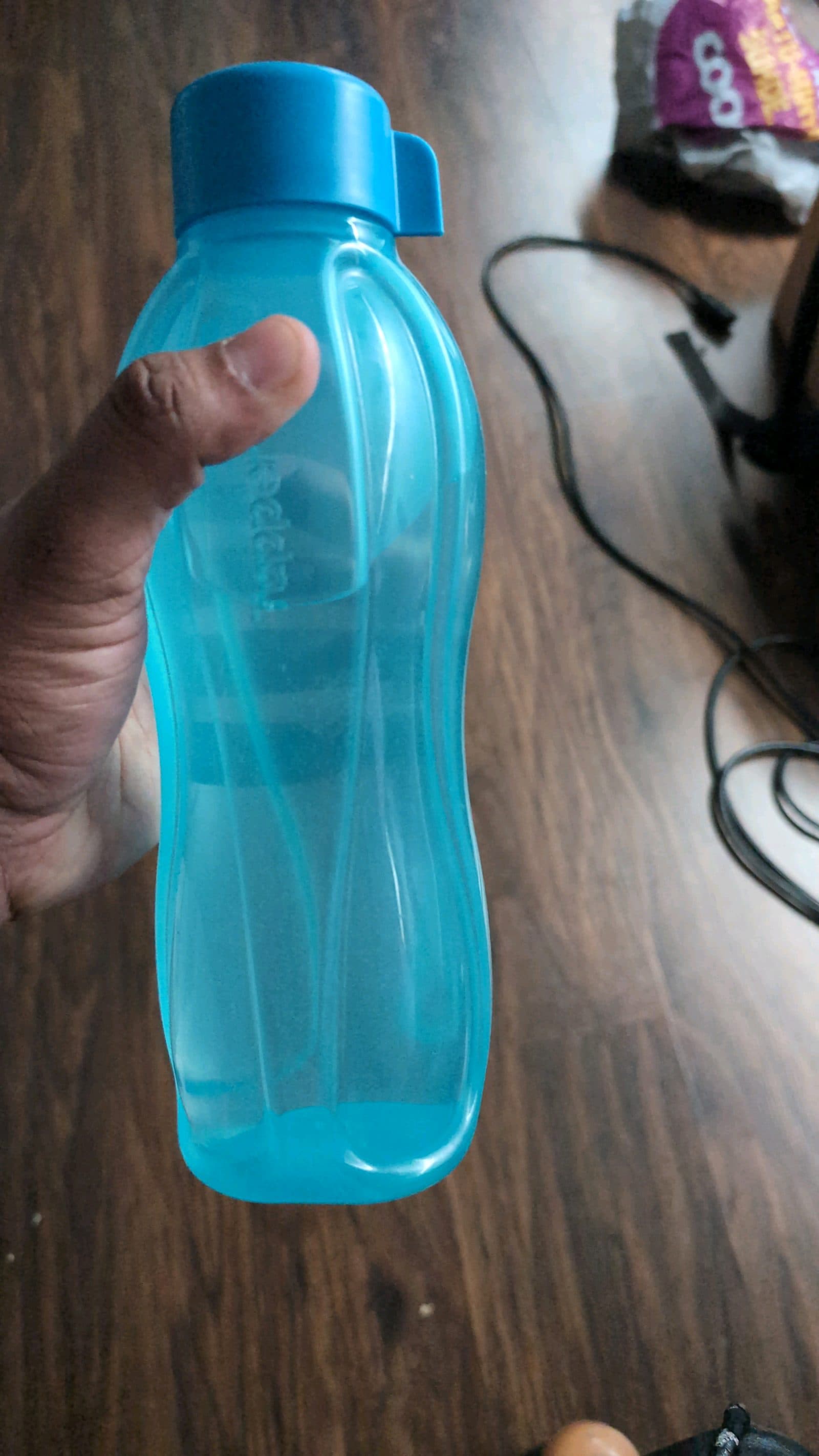 Blue reusable plastic water bottle (used) - 1 pc